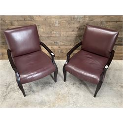 Two rosewood framed armchairs, upholstered in brown leather