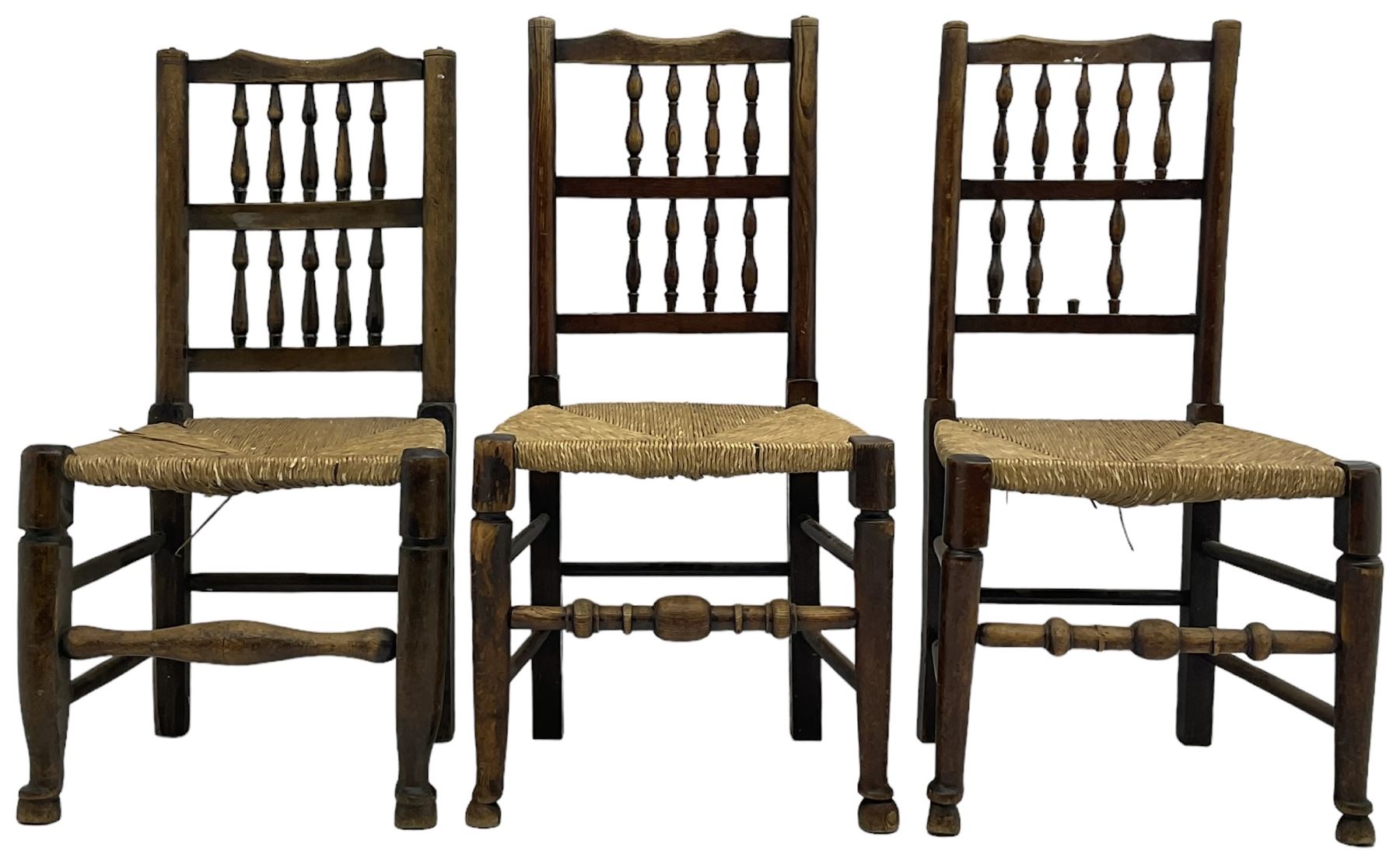 Collection of chairs - five 19th century elm spindle back chairs with rush seats; two chapel chairs (7)