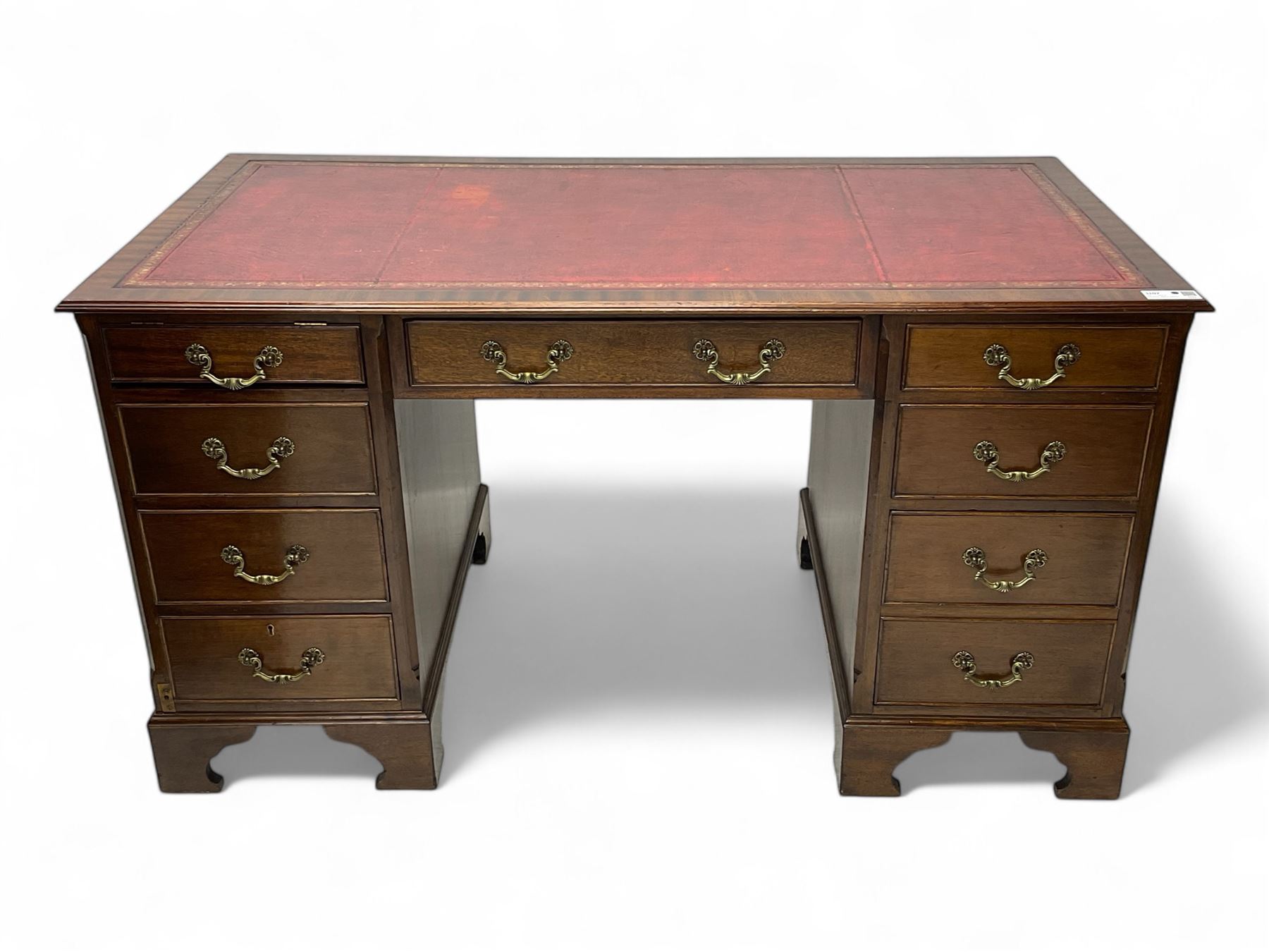 Georgian design mahogany twin pedestal desk, moulded rectangular top with red leather inset, fitted with seven drawers, on bracket feet 