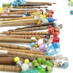 Collection of turned wooden lace maker's bobbins, including 19th century and later examples, mostly with glass spangles and turned shafts (100 approx)