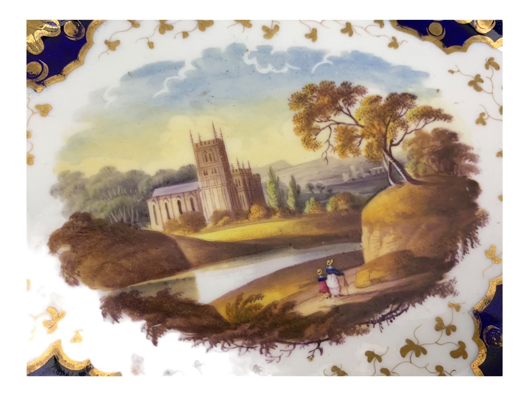 Early 19th century Ridgway twin handled oval dish, hand painted with figures in a river landscape, within a cobalt blue and moulded border, L30cm together with a similar twin handled serving dish, L28cm (2)