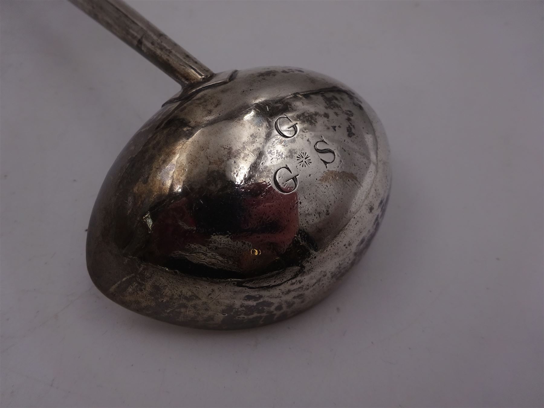 George II silver toddy ladle, the silver bowl of oval form, with engraved initials to underside, hallmarked London 1741, maker's mark indistinct, with turned wooden handle, L33cm