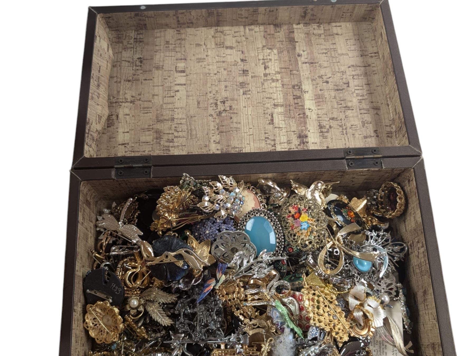 Collection of costume brooches, including ceramic, novelty and animal examples, contained within an Angel jewellery box