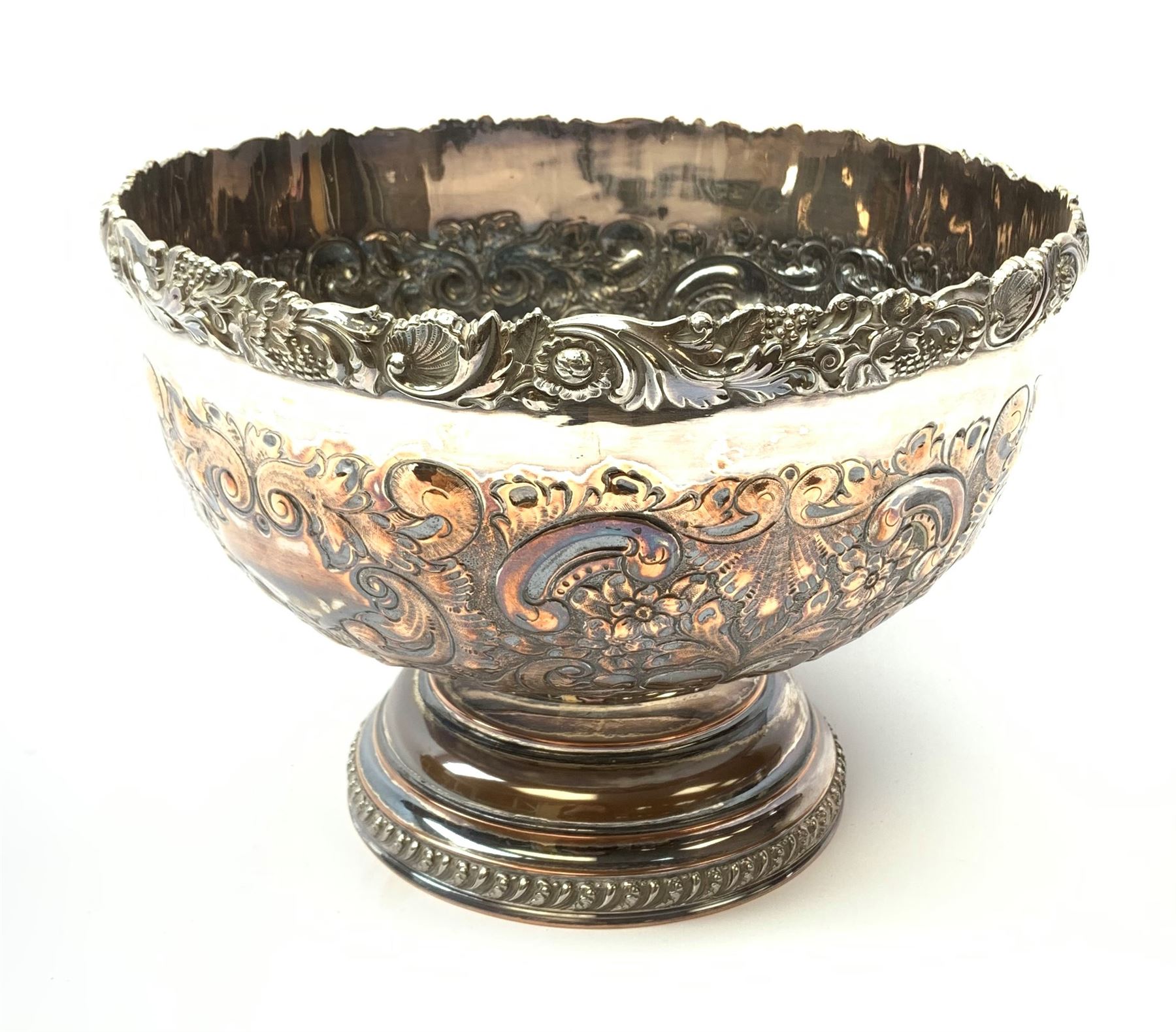 An early 20th century Barker Ellis Silver Co Ltd silver plated punch bowl, with embossed foliate detail to the body, applied rim with fruiting vines and acanthus leaves, and raised upon a stepped circular base with gadrooned detail, with MS shield mark beneath for Barker Ellis, H22c, D31cm. 