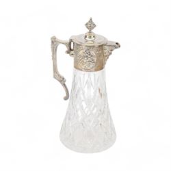 Modern silver mounted cut glass claret jug, the silver cover with engraved and embossed fl...