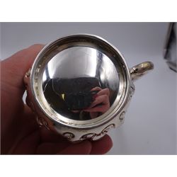 Late Victorian silver christening mug, with C handle and gilt interior, the body profusely embossed with floral and foliate decoration, hallmarked Atkin Brothers, Sheffield 1897, H10cm