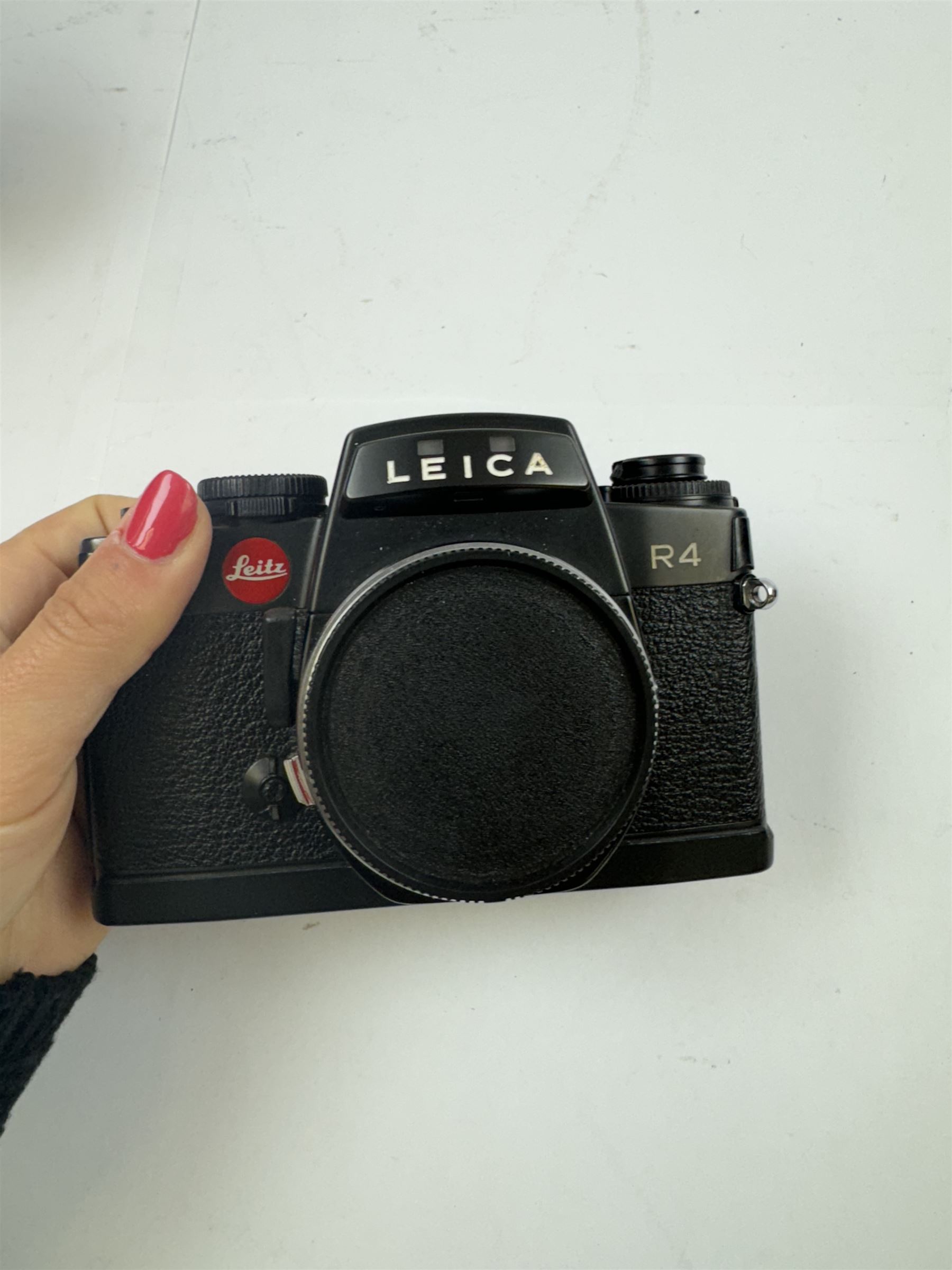 Leica R4 SLR camera body, serial no. 1609604, together with  with Leitz Vario Elmar-R 1:4 5/75 - 200mm and Elmarit -R 1:2 8/35mm lenses, and Motor Winder R4 14282, all in original boxes