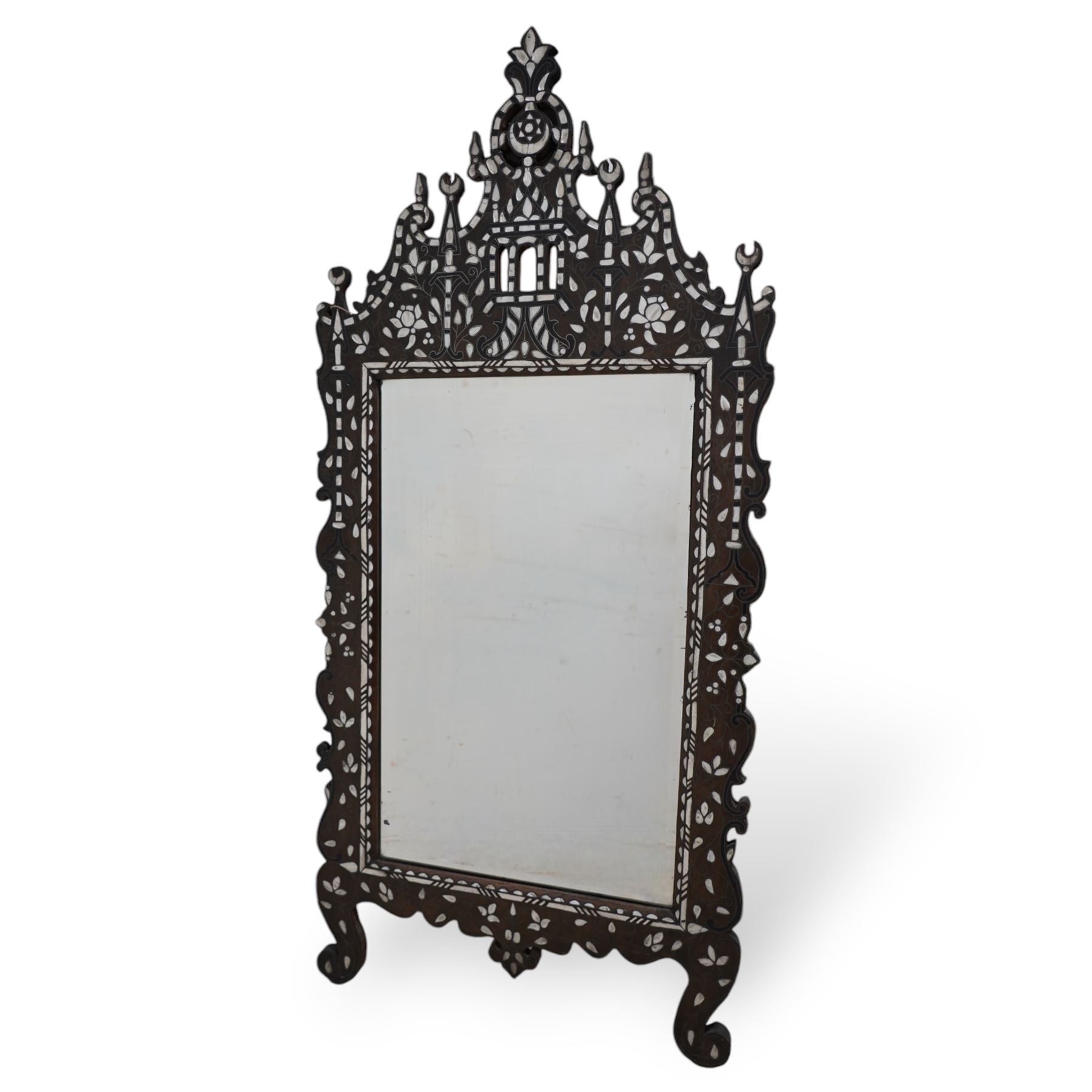 Early 20th century inlaid hardwood Damascus easel mirror, shaped and pierced pediment, inlaid with mother of pearl and carved with trailing foliage, on cabriole feet 