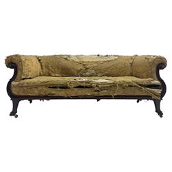 19th century mahogany settee, rolled S-scrolled arms carved with lion masks and acanthus leaf scrolls, the lower moulded rail carved with scrolling design, raised on carved paw feet with recessed brass and ceramic castors 