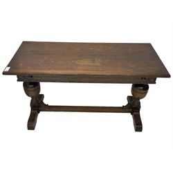 Early 20th century oak extending table, moulded rectangular top, pull-out action with fold-out leaf, on turned cup and cover pedestals and sledge feet, united by moulded stretcher 