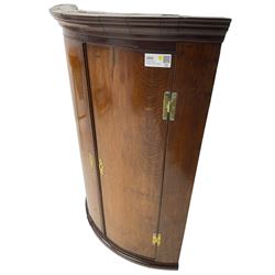 George III oak and mahogany wall hanging cylinder corner cupboard, moulded cavetto cornice over double cupboard enclosing three shelves