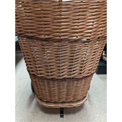 Pull along wicker basket with wicker handle, composite jointed doll and a collection of linen