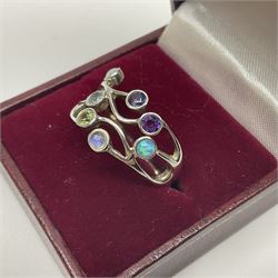 Silver ring, set with seven gemstones including opal, moonstone and peridot, stamped 925, boxed 