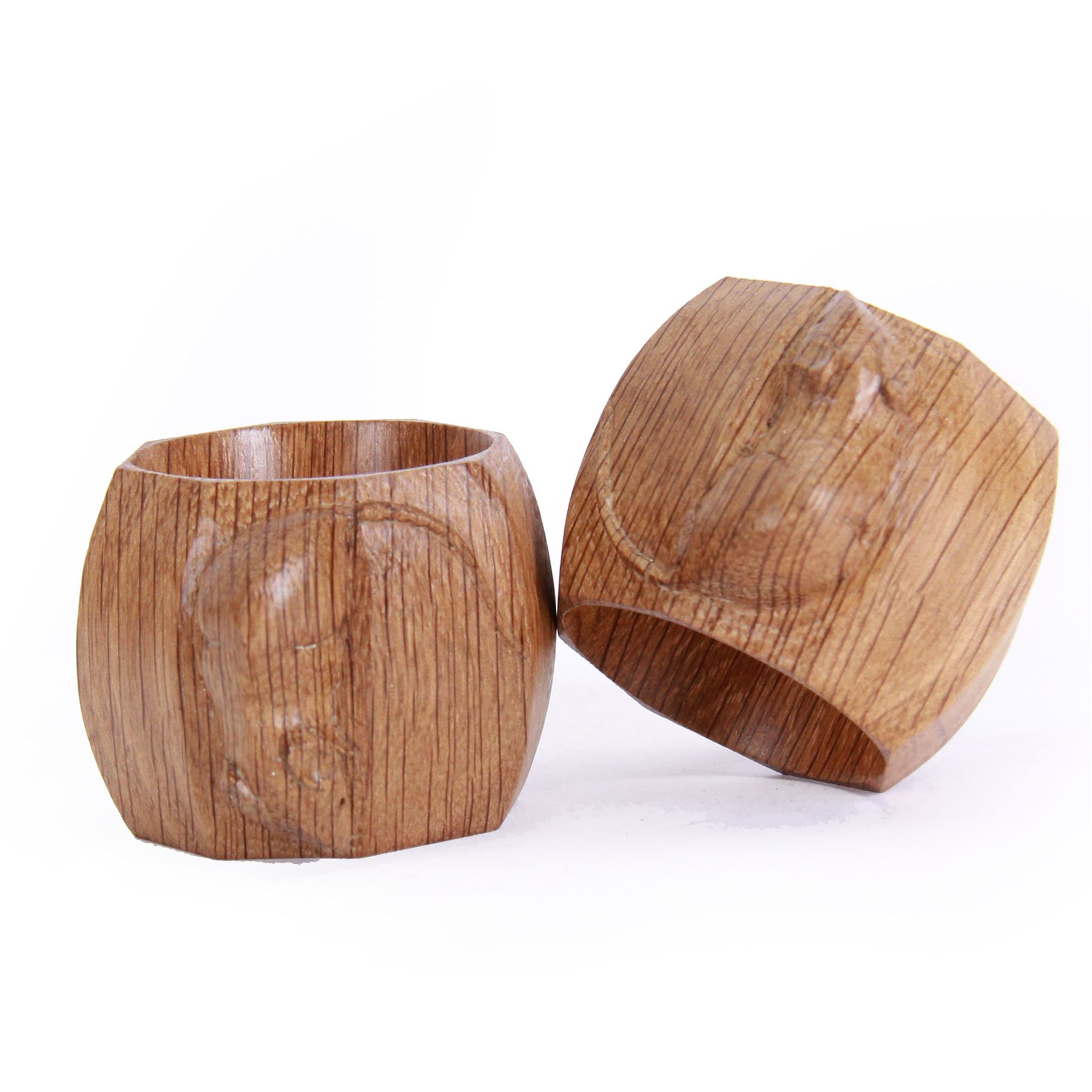 Mouseman - two oak napkin rings, bulbous octagonal form carved with mouse signature, by the workshop of Robert Thompson, Kilburn