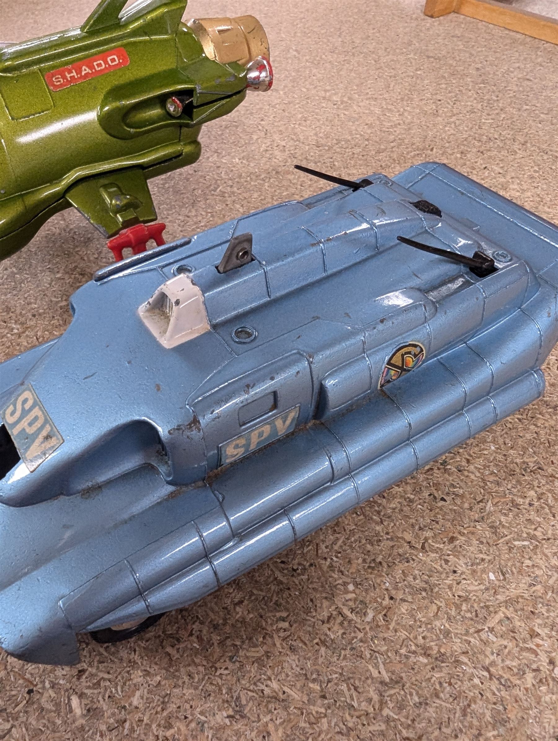 Three Dinky toys, comprising Spectrum Pursuit Vehicle, Maximum Security Vehicle, and UFO Interceptor, unboxed and playworn 