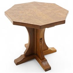 Mouseman - oak coffee table, octagonal adzed top on cruciform base and sledge feet, carved...