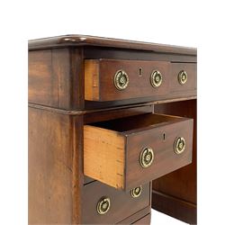 Victorian mahogany twin pedestal desk, moulded rectangular top with rounded corners and inset leather writing surface, fitted with nine drawers, on moulded plinth base