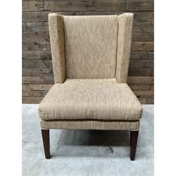 High wing back armchair, upholstered in oatmeal fabric