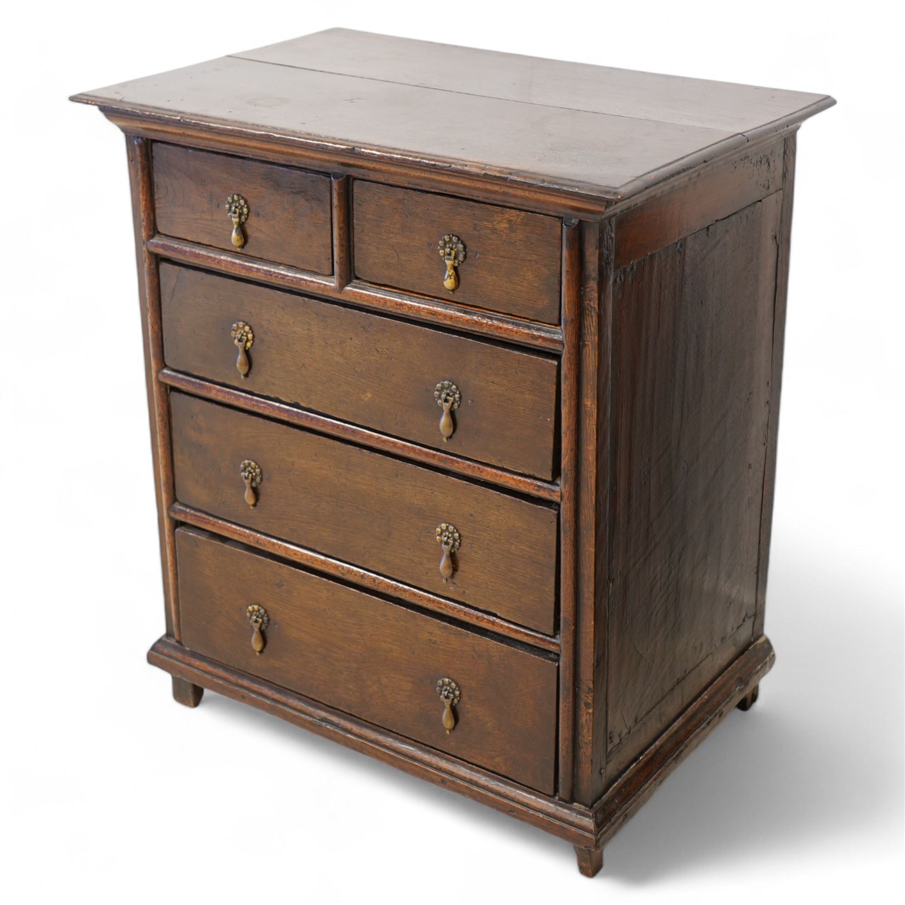 18th century oak chest, moulded rectangular top over two short over three long drawers, beaded circular handle plates and drop handles, on stile supports 