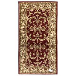 Contemporary Dunelm 'Legacy' ground rug, the field decorated with symmetrical scrolling fo...