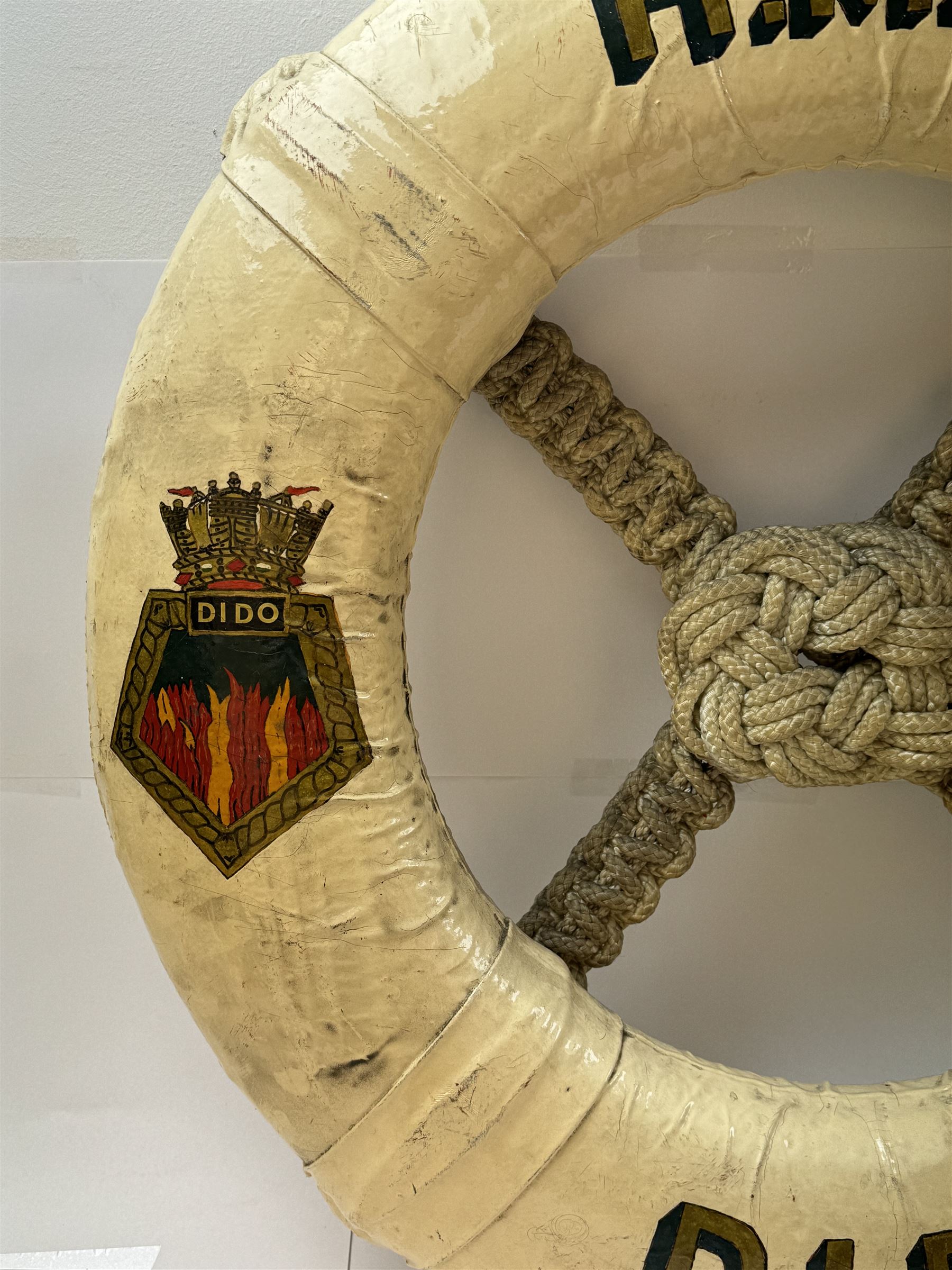 Late 19th/early 20th century ceremonial lifebuoy, from the Royal Navy light cruiser H.M.S Dido, the name painted in gilt lettering and with the ship's crest to either side, D74cm