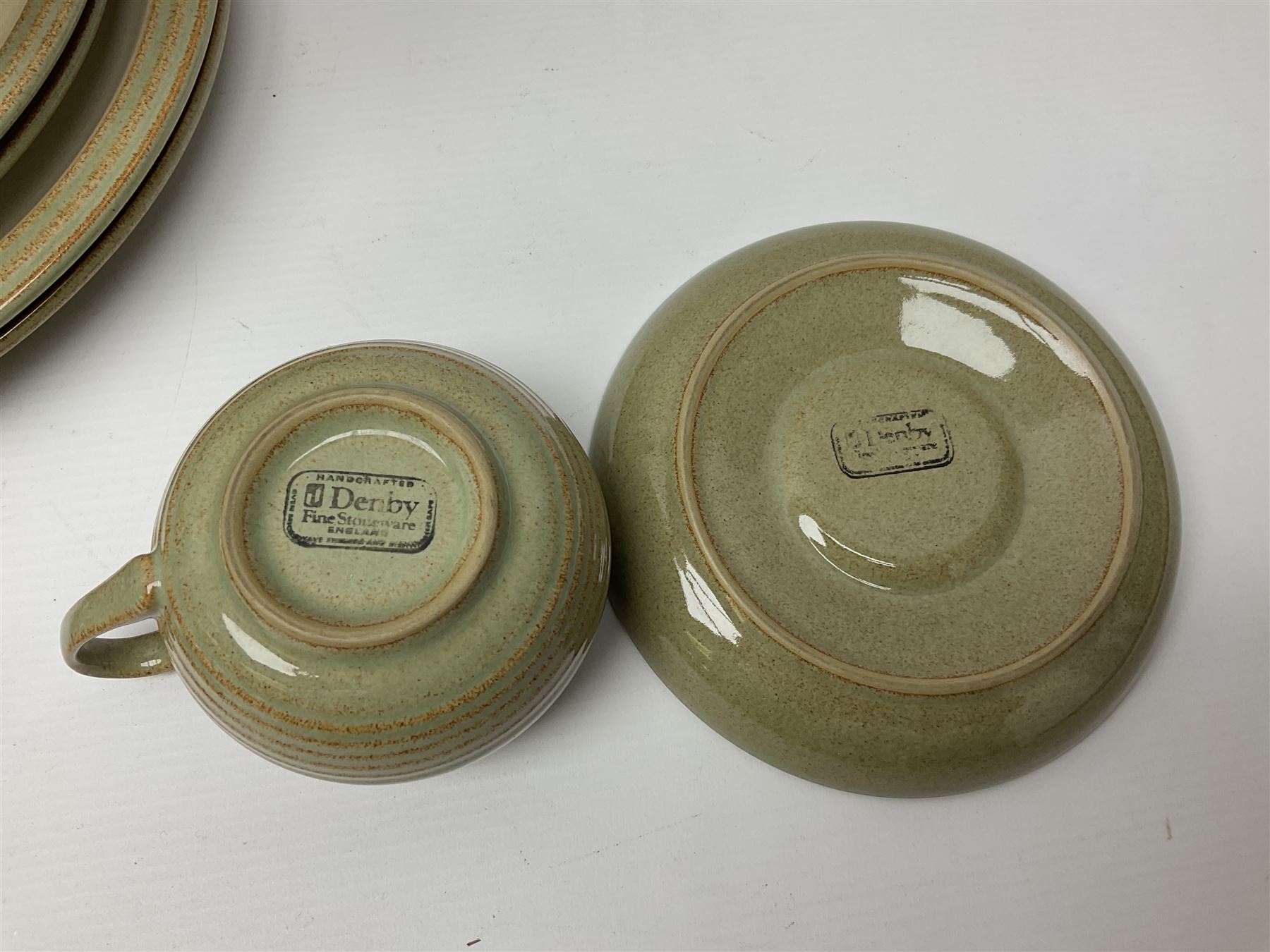 Denby tea and dinner wares, including bowls, jugs, tureens, side plates, dinner plates, serving dishes, cups and saucers, coffee pot, etc, all decorated with a green and brown mottled glaze, with printed marks beneath, in two boxes 