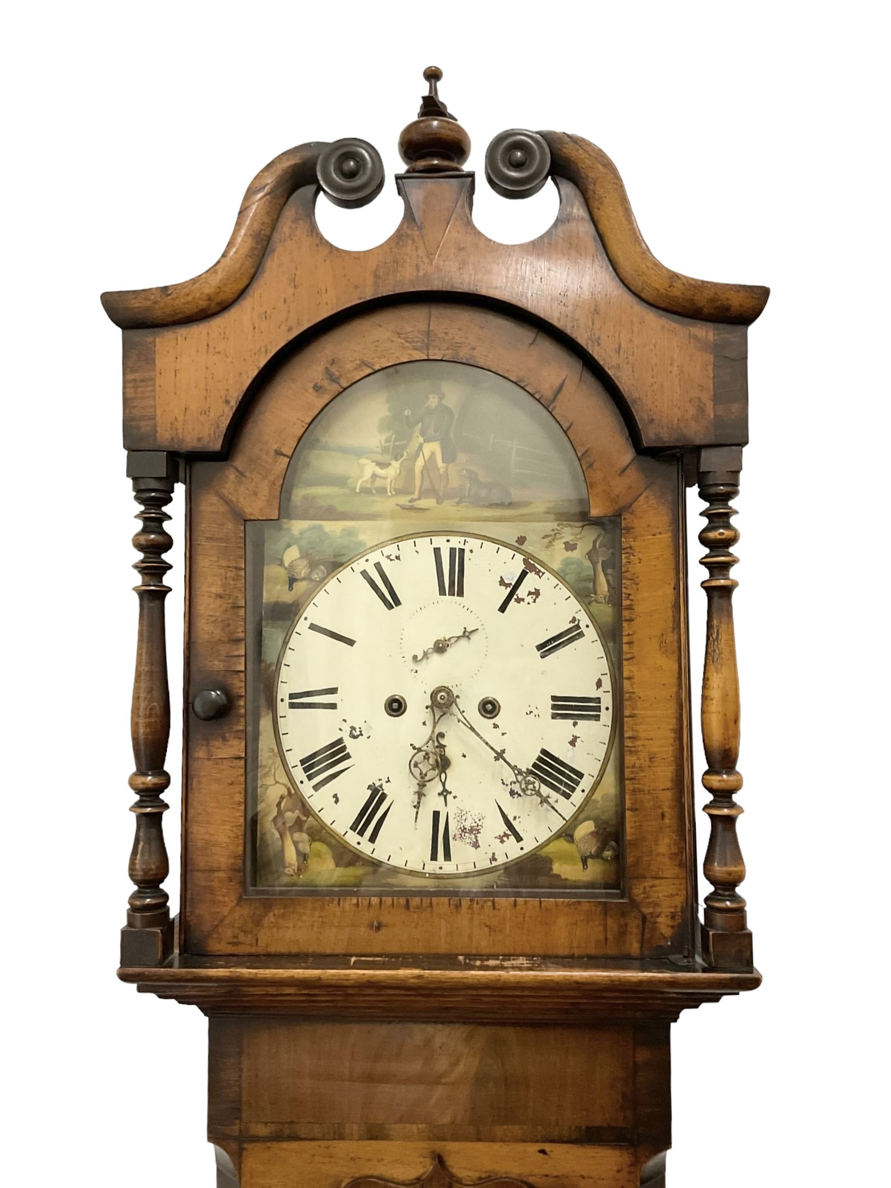 Late 19th century - oak and mahogany 8-day longcase clock, with a swan necked pediment, break arch hood door beneath flanked by ring turned pilasters, trunk with canted corners and a short wavy topped door, on a reduced plinth with no feet, painted dial with a depiction of a huntsman to the arch and game to the spandrels, with brass hands, Roman numerals and matching seconds and date dials, dial pinned directly to a rack striking movement, striking the hours on a bell. With pendulum and two weighs 