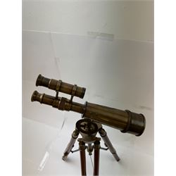 Brass telescope upon a wooden adjustable tripod, H55cm 