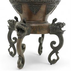 Late 19th/ early 20th century Japanese bronze Usubata vase, the flared top over two Phoenix cast handles, the ovoid body decorated in relief with mythical creatures within roundels, on four open mouth lion mask and scroll supports, H43cm x W24cm 