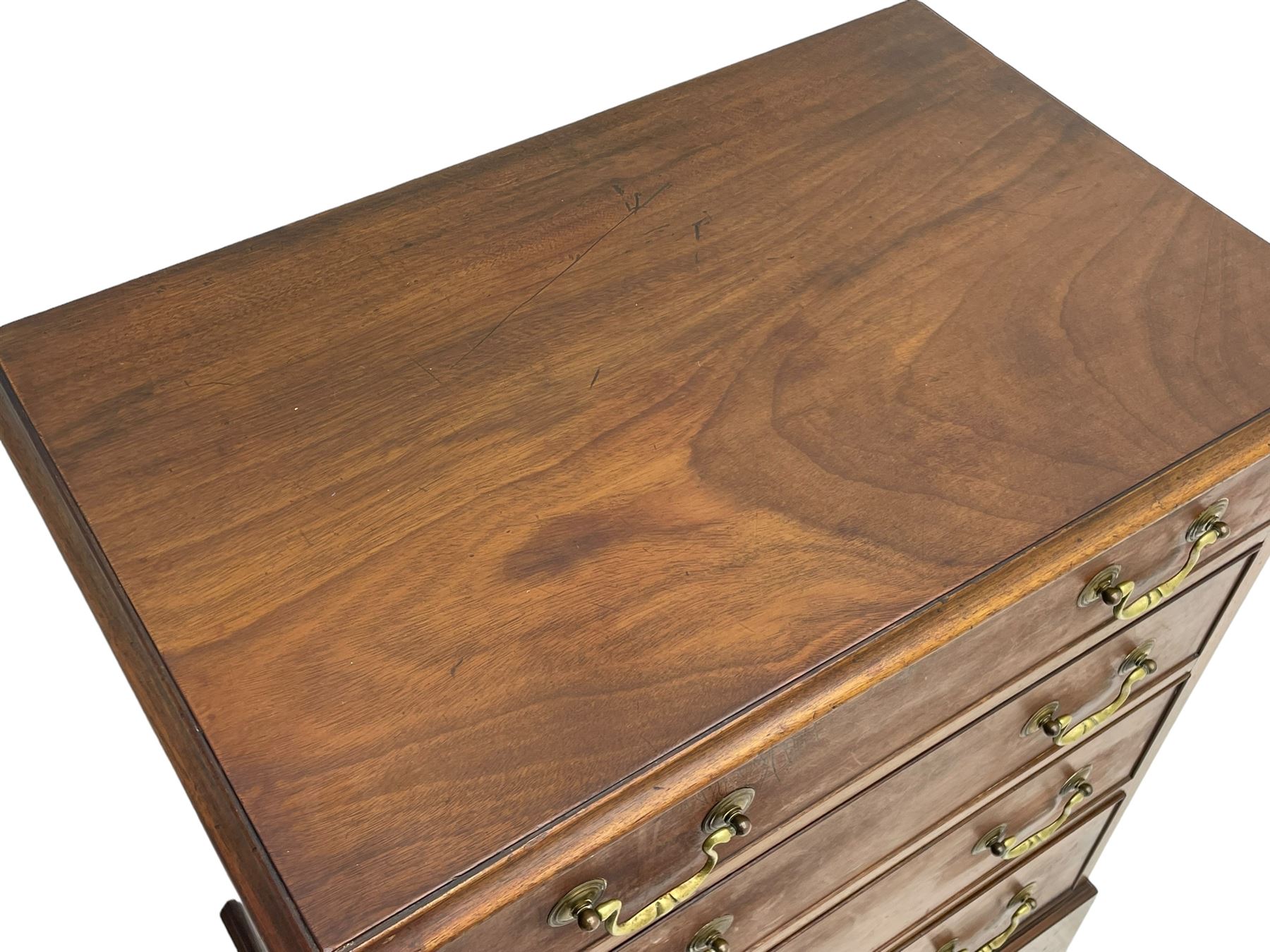 Small Georgian and later mahogany chest, moulded rectangular top over four long cock-beaded drawers, on bracket feet