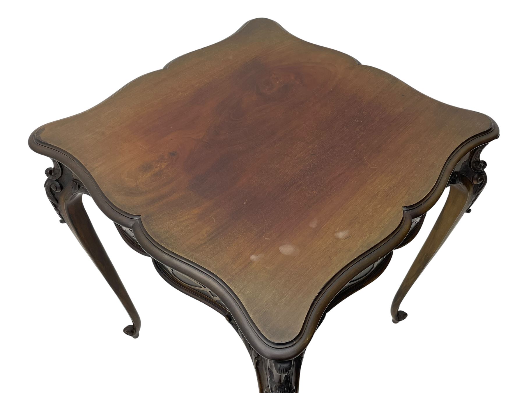 Early 20th century mahogany centre table, shaped moulded top over shaped frieze rails decorated with blind fretwork, on C-scroll and acanthus leaf carved cabriole supports with scrolled terminals 