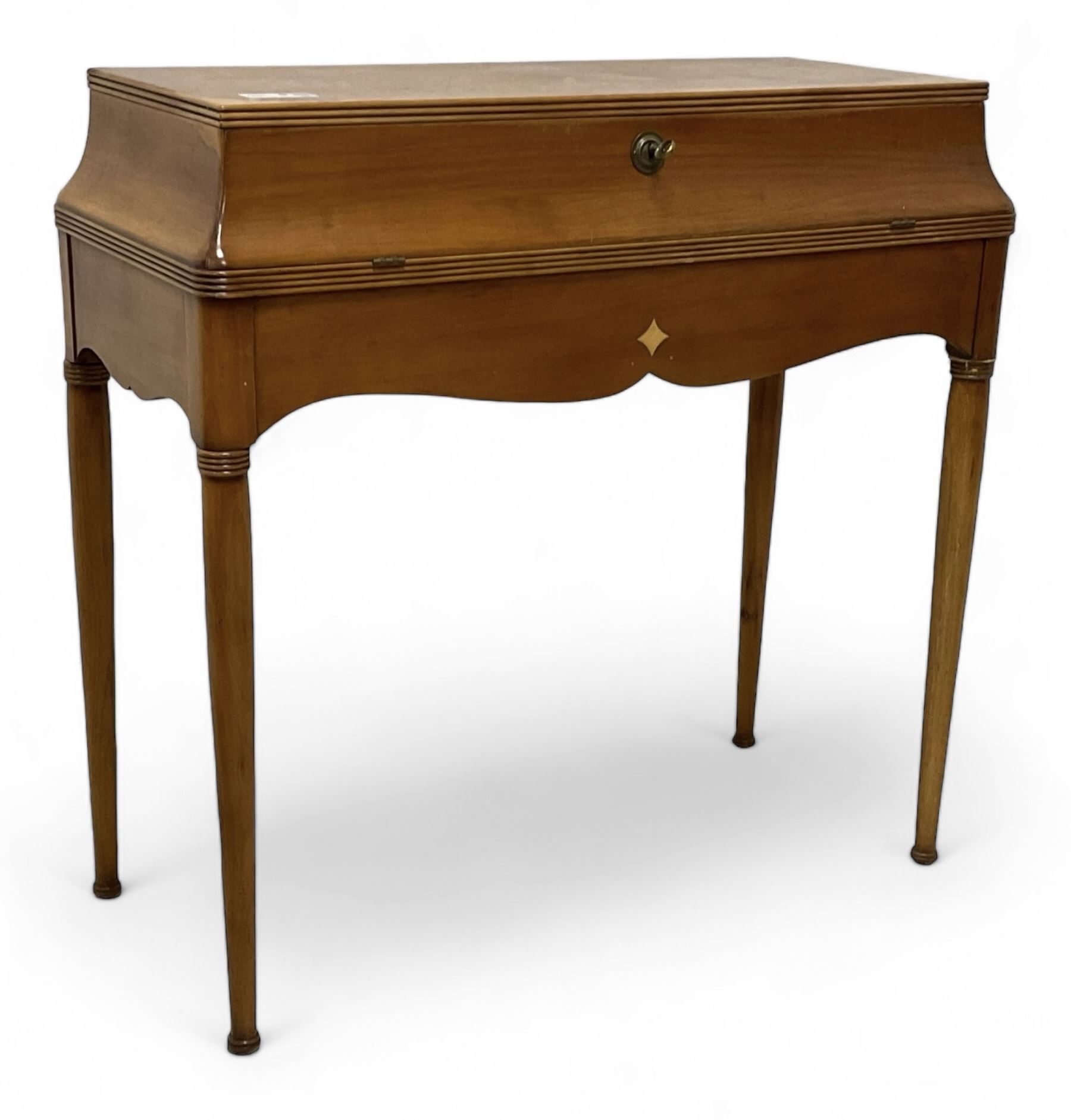 French design cherry wood dressing table, reed moulded hinged lid reveals mirror back, central compartment with lid and divisions, on turned supports