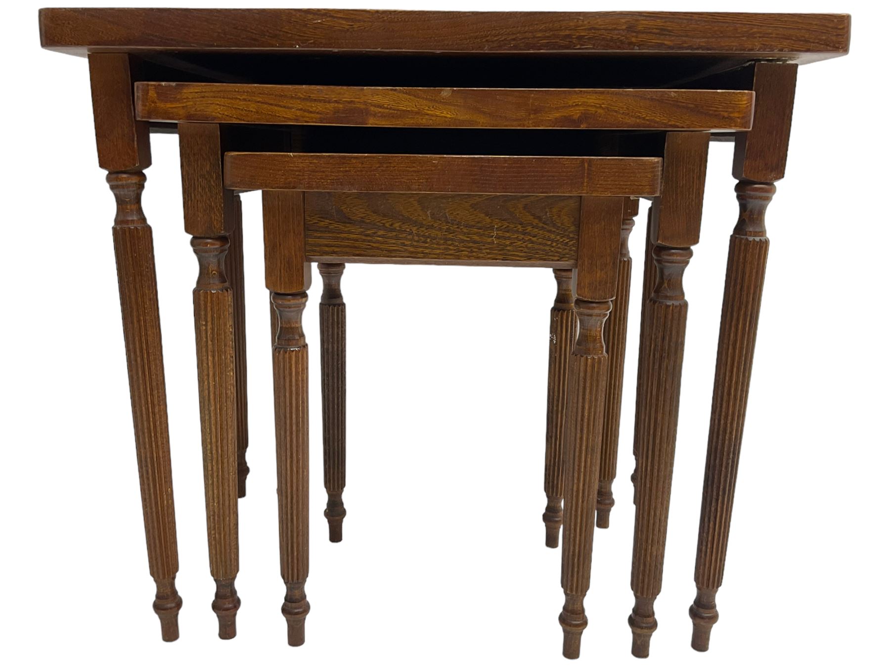 19th century design elm nest of three tables, rectangular shaped top, raised on tapering reeded supports 