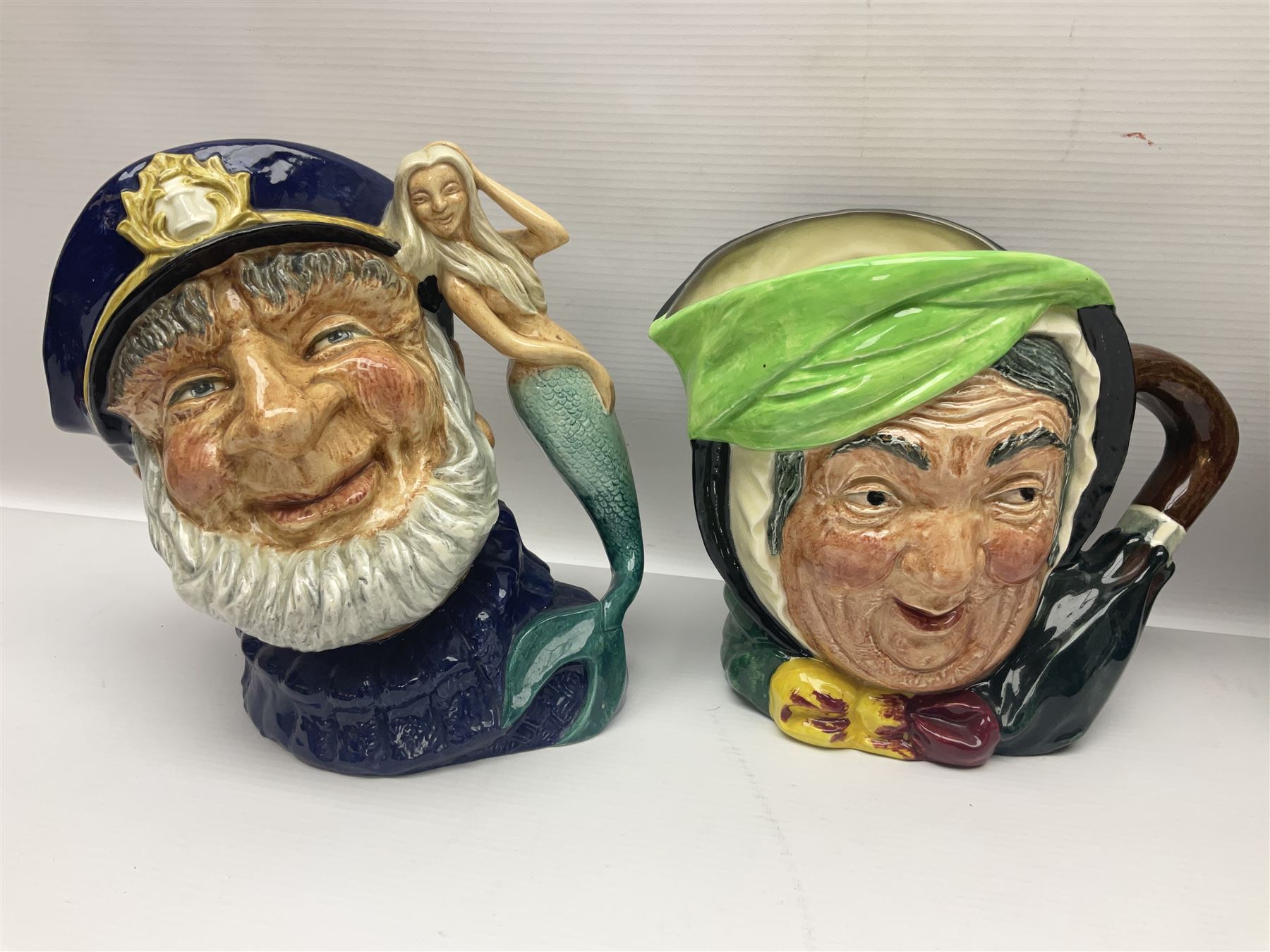 Twenty two Royal Doulton toby and character jugs, including Ugly ...