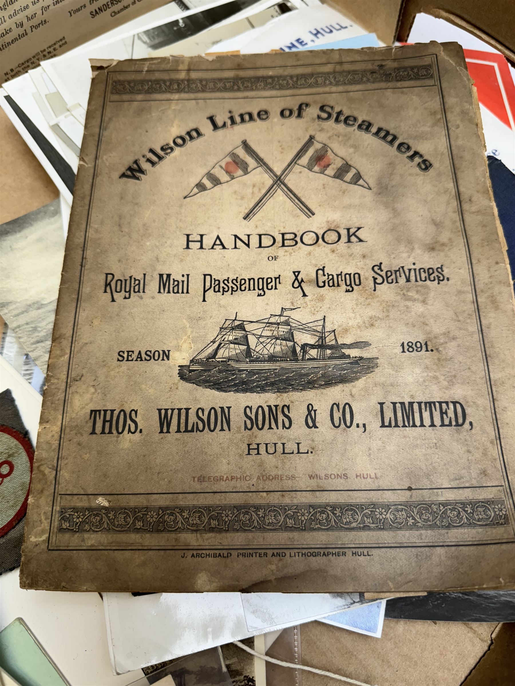 Collection of martime and shipping collectables, including brass cased gimbal compass, marked Castle & Co, Hull, cast iron Britains Pride doorstop, buttons, Lloyds Register, photographs, postcards and other ephemera