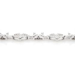 18ct white gold baguette and round brilliant cut diamond flower and circular link bracelet, stamped 750, total diamond weight approx 3.70 carat