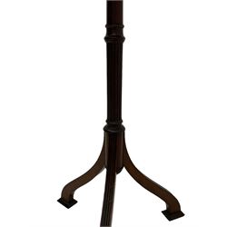 Early 20th century mahogany wine table, figured circular top with reeded edge, on turned and reed moulded stem, three reeded tapered supports on rectangular moulded pad feet 