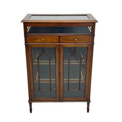 Edwardian mahogany bijouterie display cabinet, featuring satinwood inlay and crossbanding, hinged glazed top fitted with two banded drawers, over two astragal glazed doors enclosing black wool baize lined shelves with gold trim, supported by spade feet