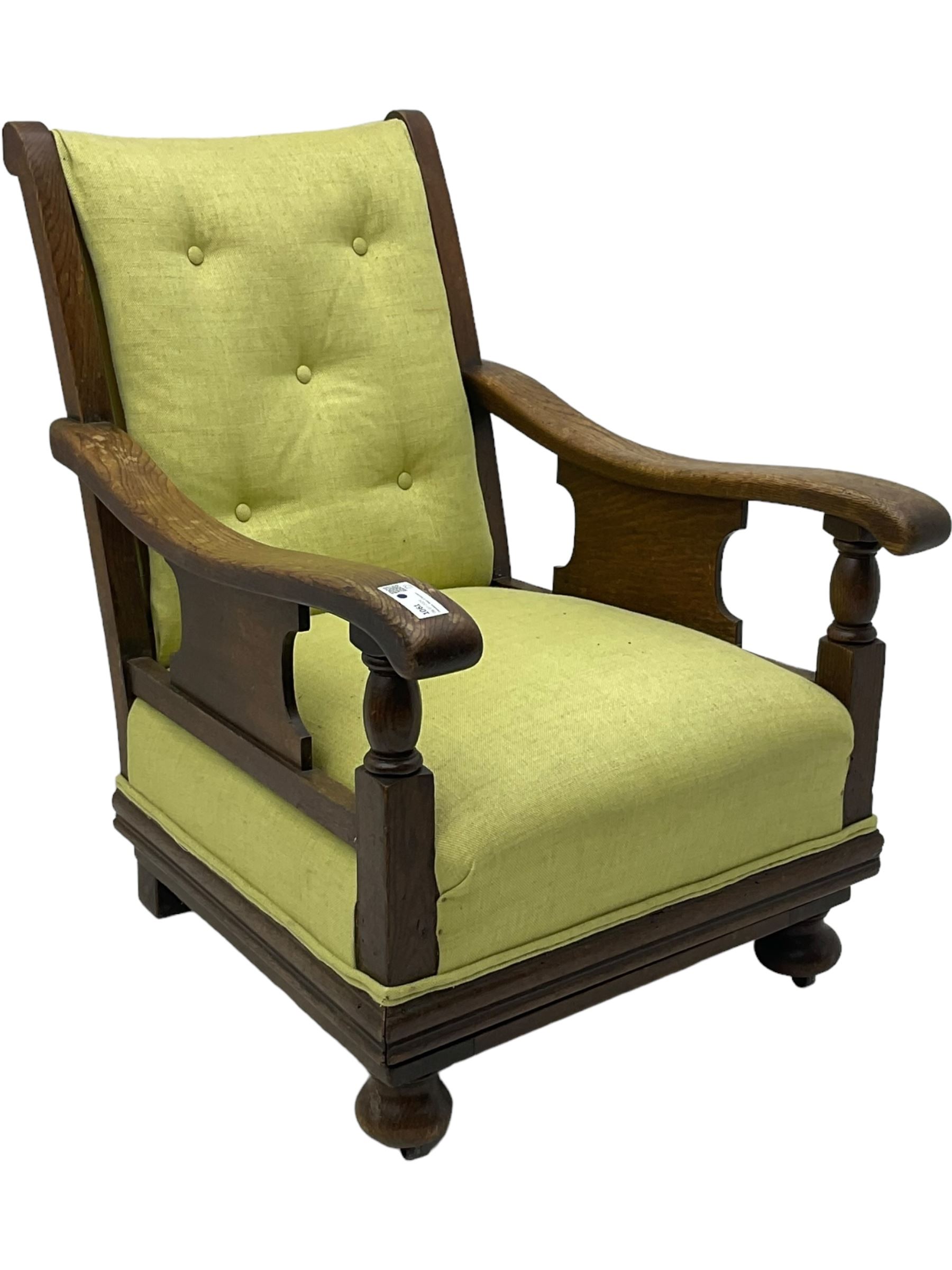 20th century oak framed rocking chair, curved armrests with shaped support panel, upholstered in lime-green fabric with button-tufting on the backrest, concealed springs to facilitate rocking motion underneath, supported by turned front legs with castors