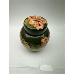 Moorcroft ginger jar in Hibiscus pattern on green ground, with makers mark beneath, H16cm