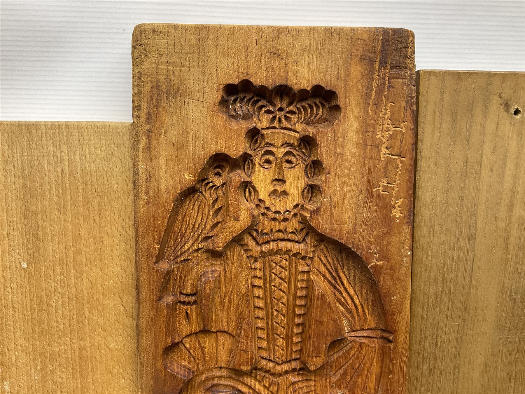 Collection of 20th century beech and other hardwood Dutch folk art Speculaasplank or biscuit moulds, most examples typically carved with figures in traditional dress, tallest H52cm