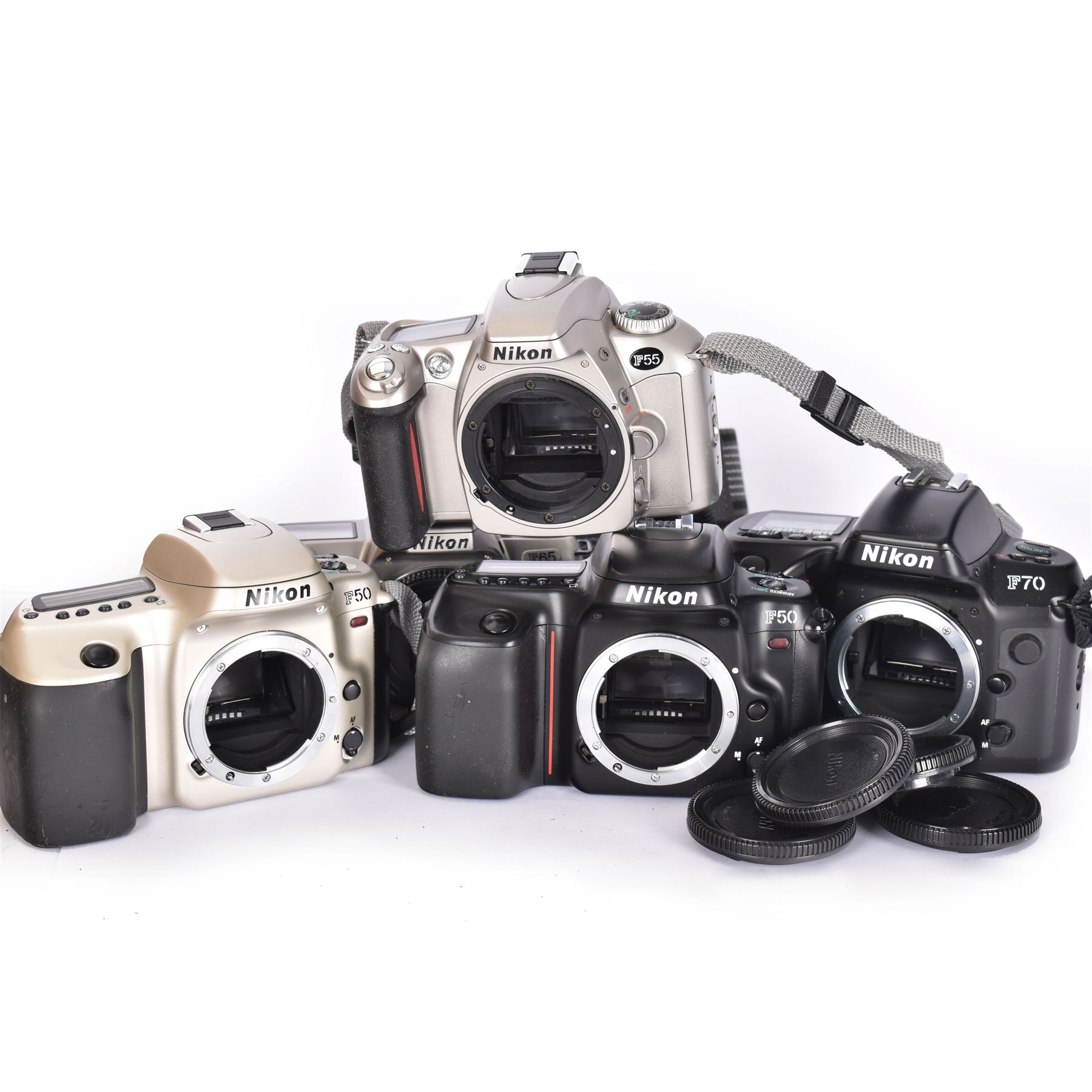 Collection of Nikon cameras, to include two F50 examples serial nos. 2966359 & 2243577, two F55 examples serial nos. 2608864 & 2024822, one with a AF Nikkor 28-80mm 1:3.3-5.6 G lens serial no. 3506212, F65 serial no. 2568057 and a F70 serial no. 2643064