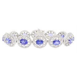 18ct white gold tanzanite and diamond bracelet, twelve oval link clusters set with oval cut tanzanite's and round brilliant cut diamonds, stamped 750, total tanzanite weight approx 11.00 carat, total diamond weight approx 3.65 carat