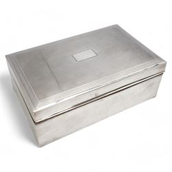 Large rectangular silver cigar box with engine turned hinged cover, vacant cartouche and d...