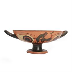 Greek Attic Black-figured eye cup, of typical form with twin handles, the exterior painted...