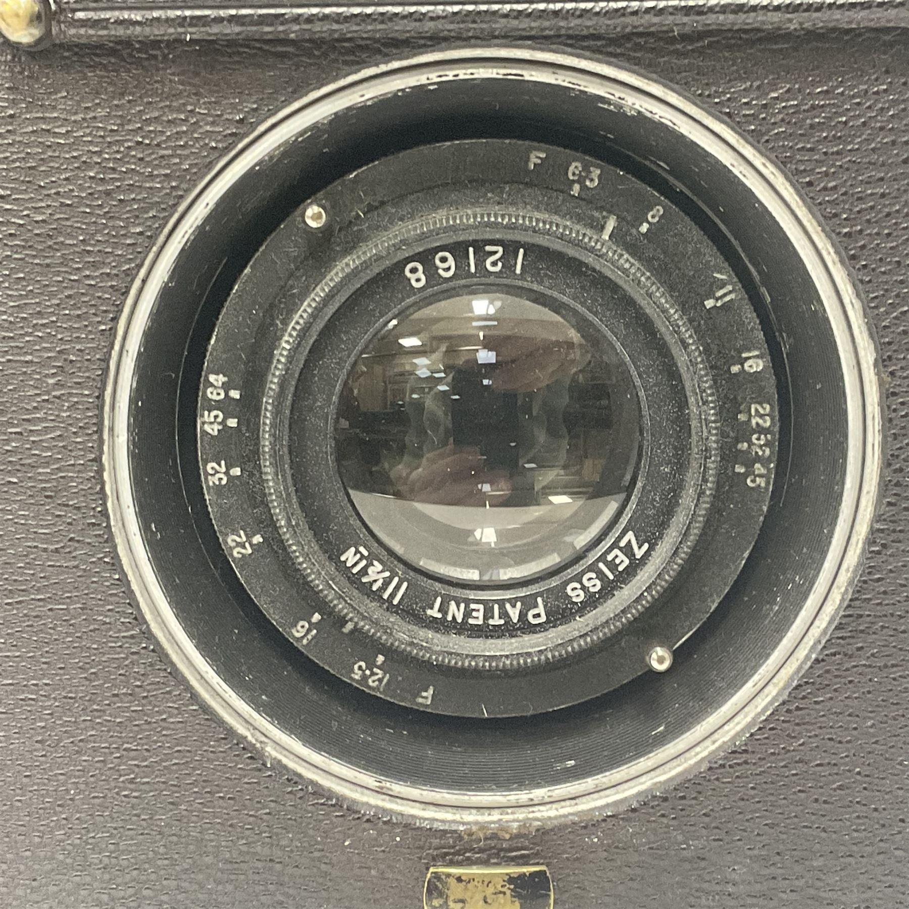 Early 20th century Adams and Co 'Videx' folding plate camera, in original leather carrying case, with various quarter plates