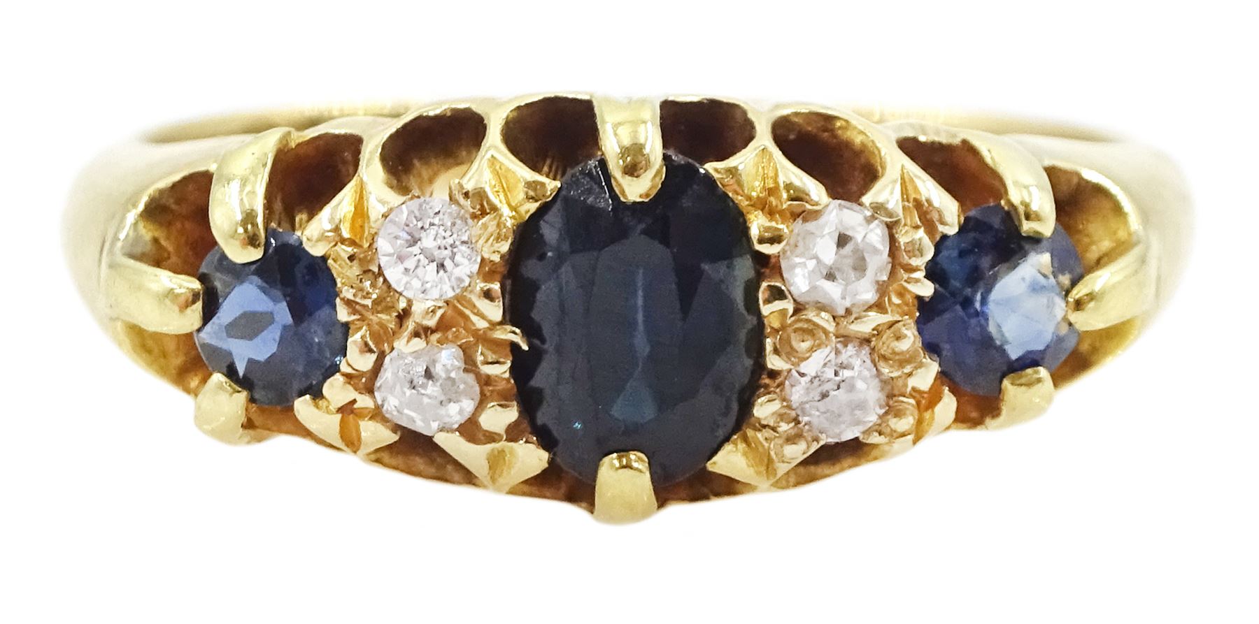 Early 20th century 18ct gold three stone sapphire and four stone old cut diamond ring