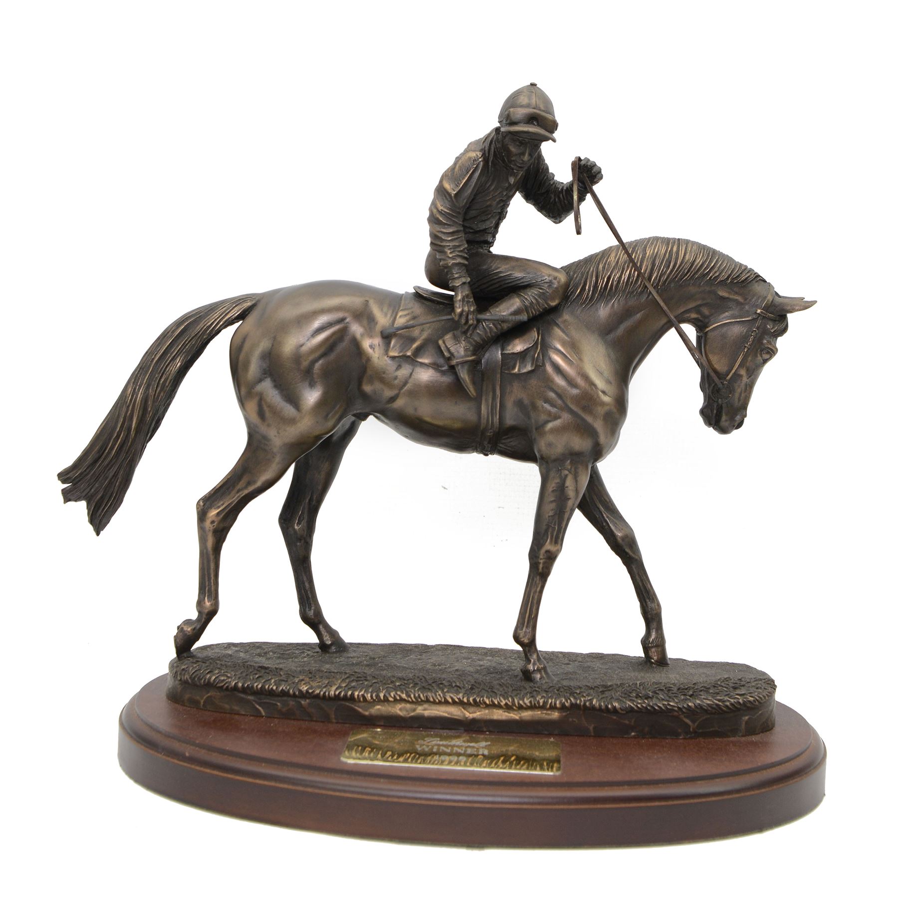 'Southwell, Winner 1995' - bronzed resin trophy by David Geenty of a racehorse with jockey up on oval wooden base, signed 30cm x 32cm 