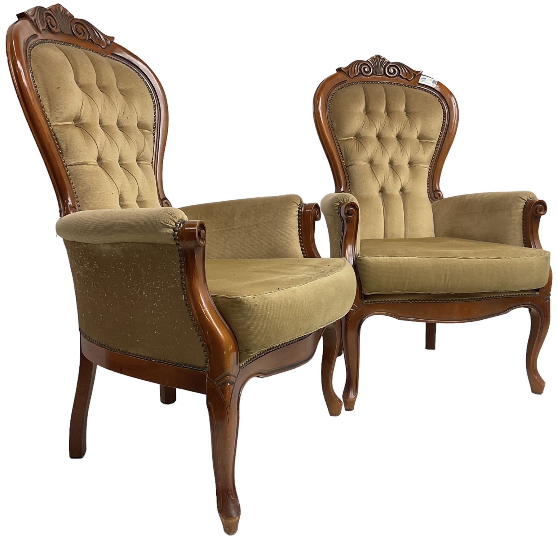 Pair of Victorian design stained beech armchairs, scroll and scallop carved cresting rail, upholstered in buttoned champagne fabric, on cabriole supports