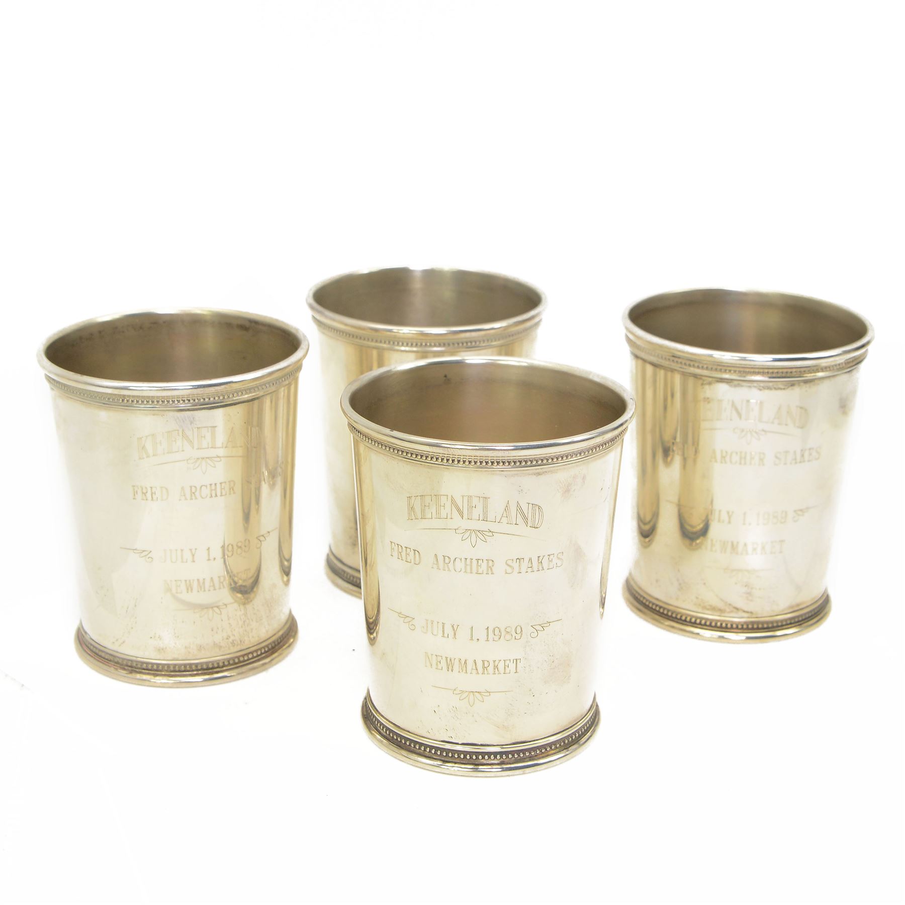 'Keeneland Fred Archer Stakes, Newmarket July 1989' - Set of four American silver julep cups by Mark Scearce, Shelbyville, Kentucky, with Ronald Reagan presidential mark for the second term of the Reagan presidency 1986-1989 each H10cm in mahogany case